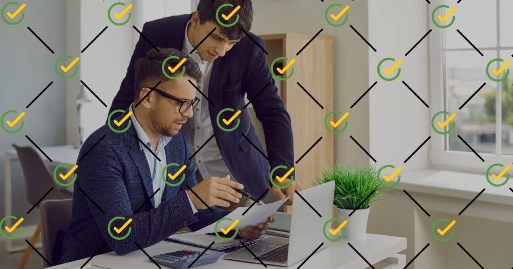 Two CFOs working on finance reviews